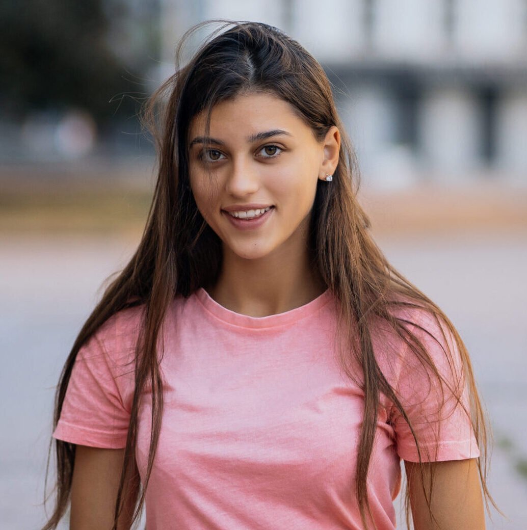 cheerful young woman taking notes while sitting steps street scaled e1756228742753